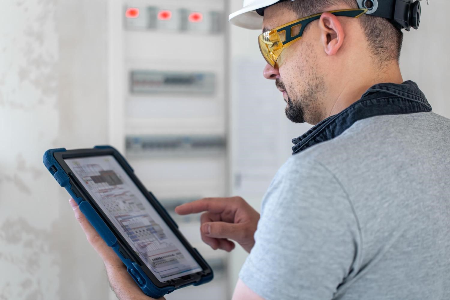 Technician performing preventive fire safety inspection in a Chicago multi-unit residential building